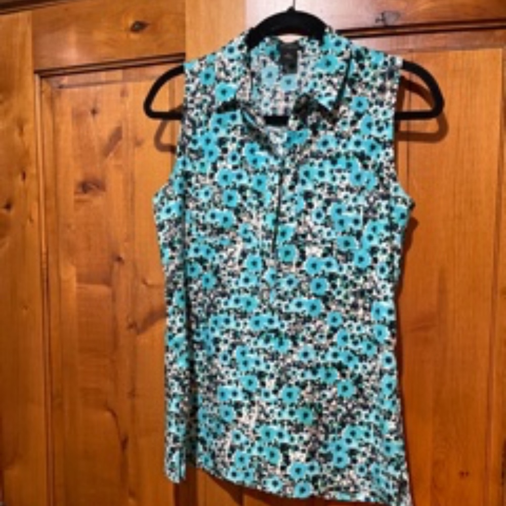 Sleeveless, half way button down, teal, black and white floral top.